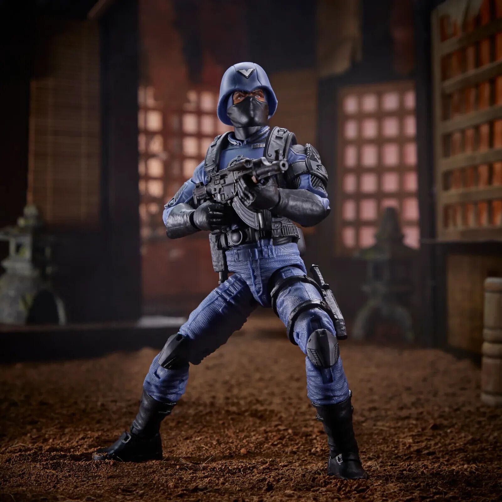 Highly detailed Cobra Officer action figure. Blue and black uniform. Wide stance, machine gun aimed and ready to fire.