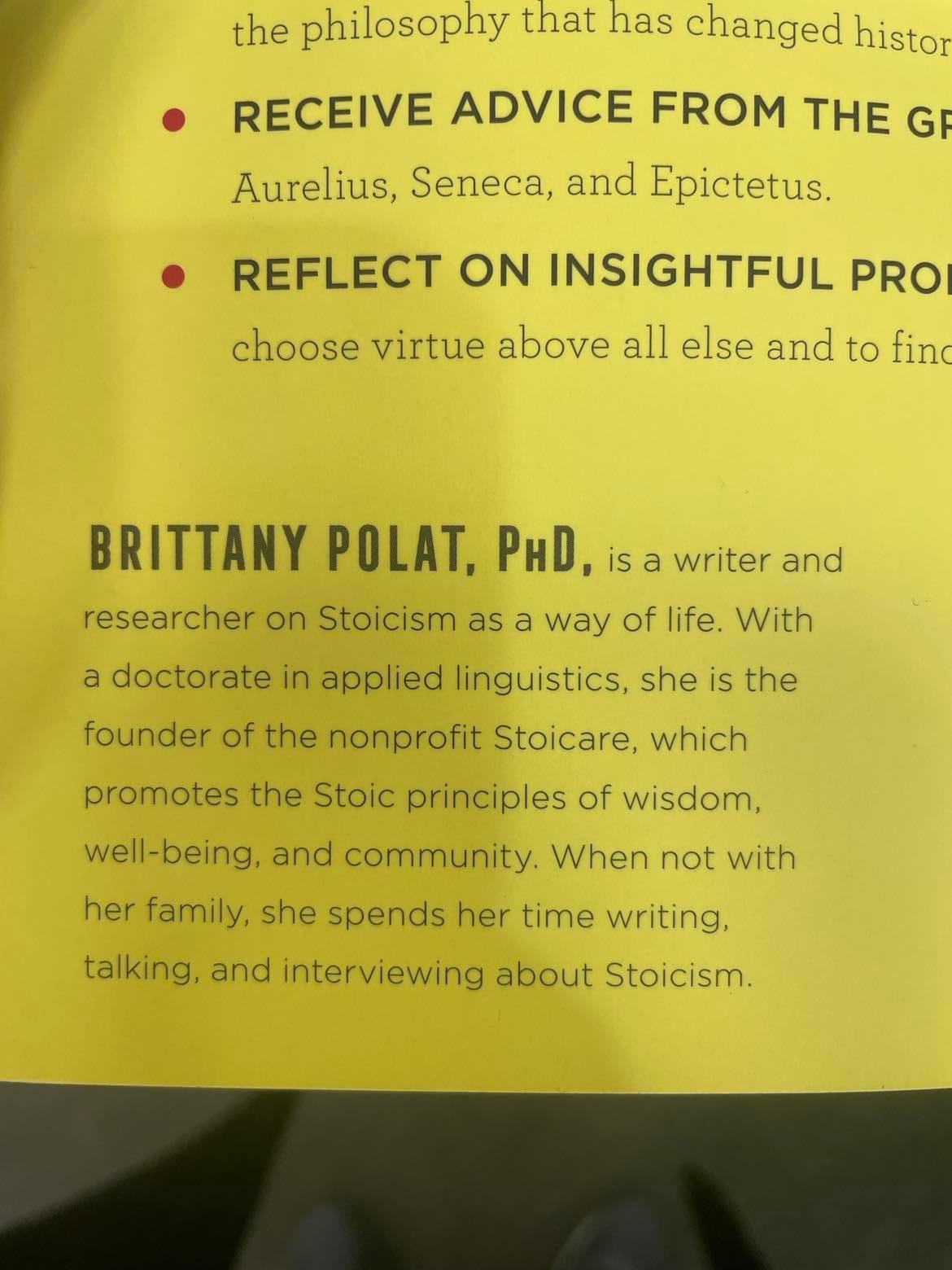 Author bio on a book cover: "Brittany Polat, PhD, is a writer and researcher on Stoicism as a way of life. With a doctorate in applied linguistics, she is the founder of the nonprofit Stoicare, which promotes the Stoic principles of wisdom, well-being, and community. When not with her family, she spends her time writing, talking, and interviewing about Stoicism."